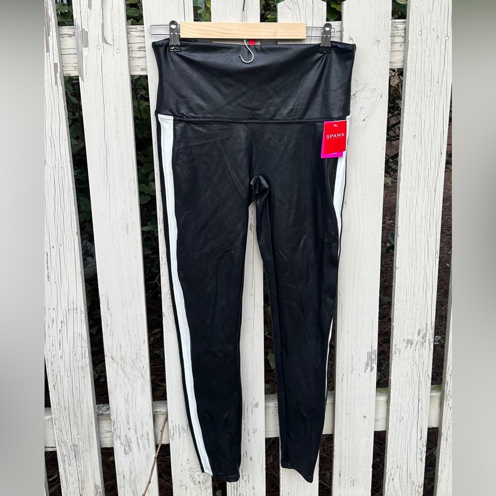 Spanx Faux leather black leggings with white stripe.